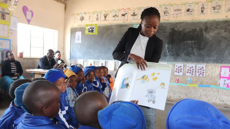 Teacher engages with children in classroom
