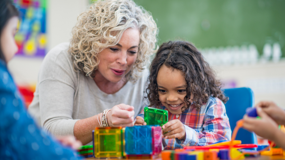 Young child learning through play at a nursery