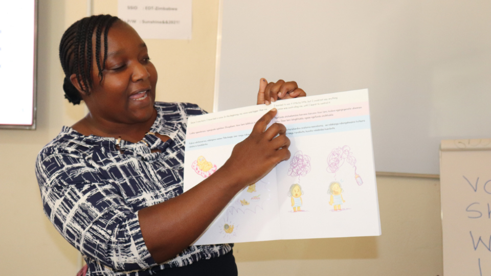 Teacher in a classroom pointing at work